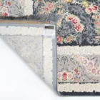 A beautiful, intricately designed carpet with a floral pattern, showcasing the art of carpets and rugs