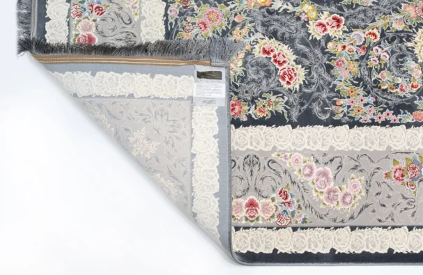 A beautiful, intricately designed carpet with a floral pattern, showcasing the art of carpets and rugs