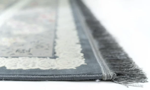 Carpets A close-up of a carpet's edge, with a focus on the intricate design and the soft, fluffy texture of the carpet's edge