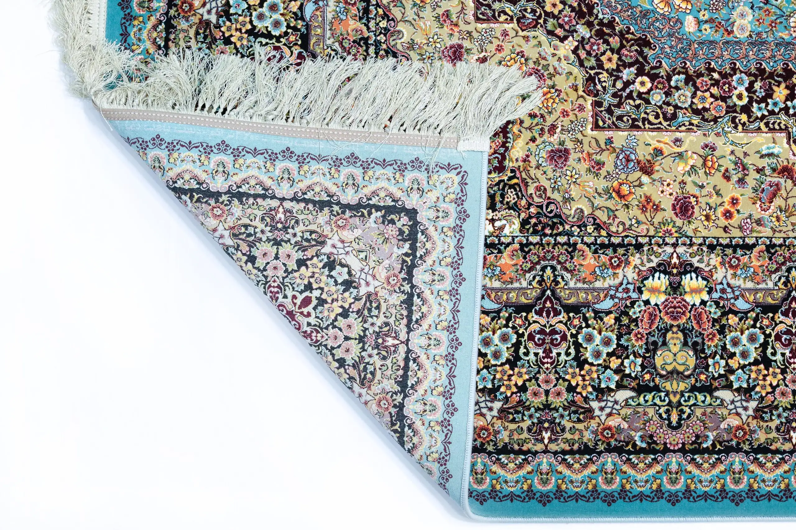A Qaleen Carpets rug with a mix of floral and geometric patterns, featuring a mix of pastel and earthy colors, with a fringe