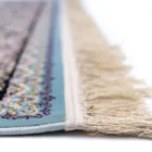Carpets A close-up of a rug's edge, with a soft, intricate pattern and a delicate, soft-looked fringe