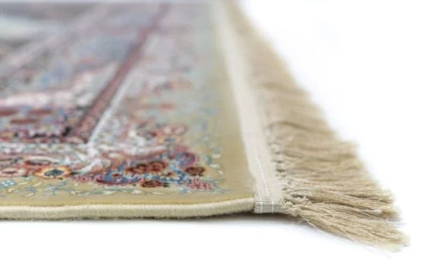 A close-up of a carpet's edge with a delicate, intricate design and a soft, fluffy texture, showcasing the beauty of carpets