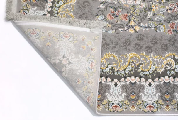 A beautifully designed carpet with a floral pattern, showcasing the art of carpets and rugs