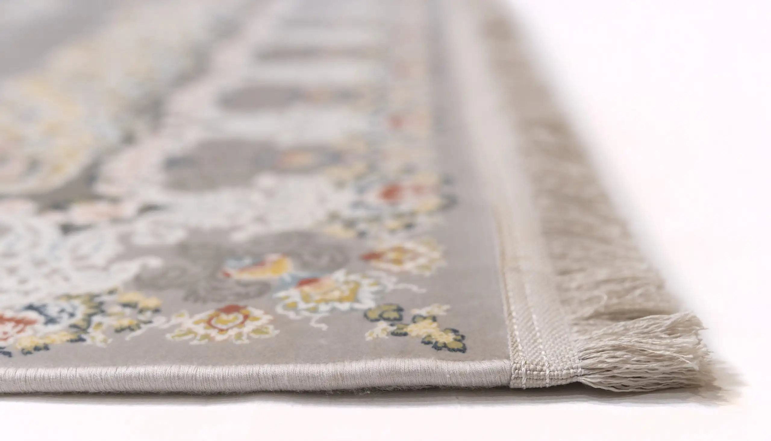 Carpets A close-up of a carpet's edge, with a focus on the intricate patterns and colors