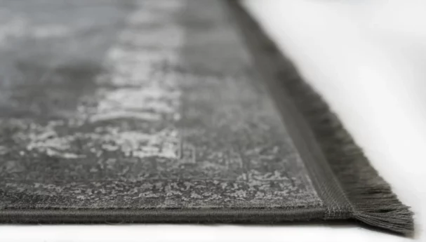 Carpets A close-up of a carpet's edge, with a focus on the intricate pattern and the soft, fluffy texture of the carpet's