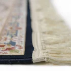 A close-up of a rug's edge, with a focus on the intricate carpeting and rug design, showcasing the beauty of carpets and rugs