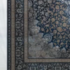 Carpets A beautiful, intricately designed carpet with a rich, dark blue background and intricate gold and silver patterns