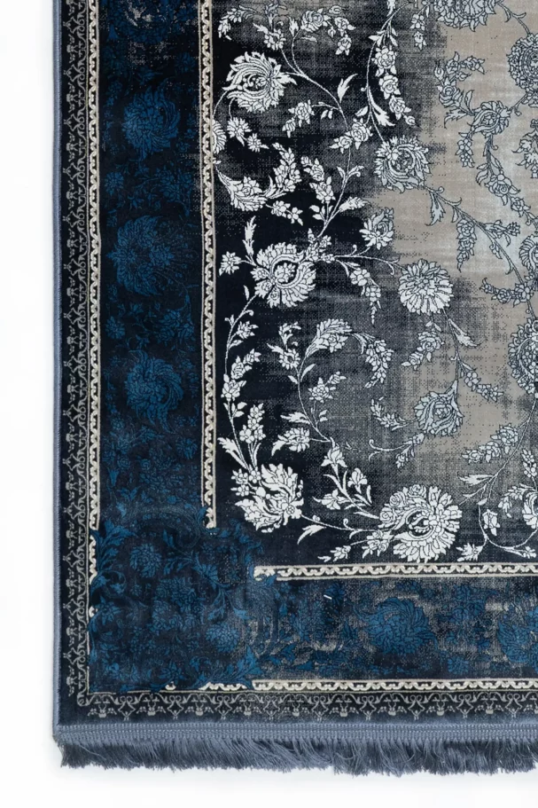 Carpets A close-up of a carpet's edge, with a blue and white floral pattern
