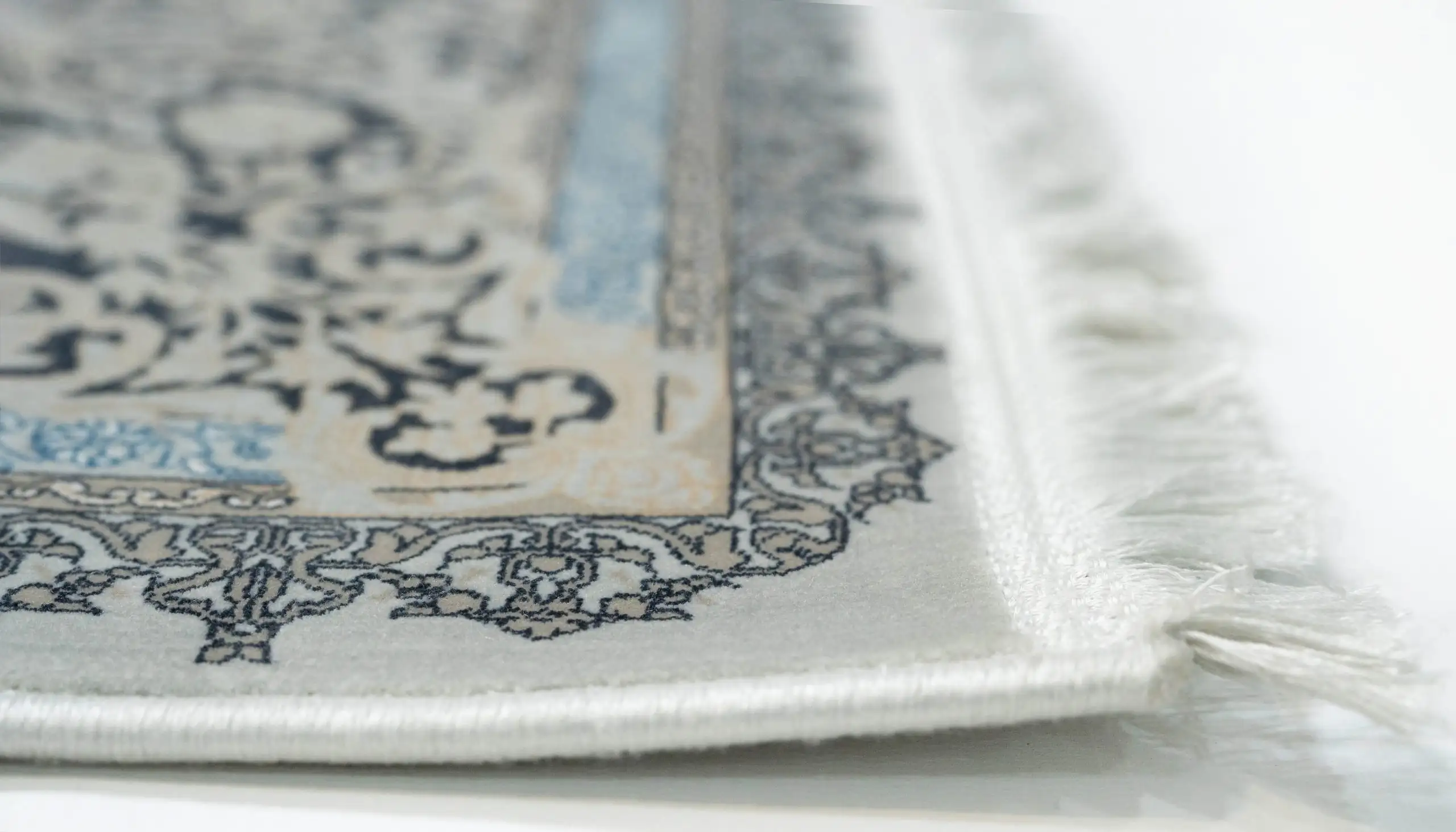 Carpets A close-up of a carpet's edge, with a focus on the intricate design and texture