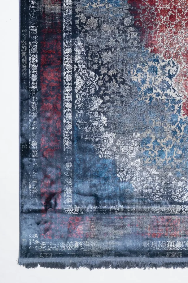 Carpets A beautiful, intricately designed carpet with a mix of red, blue, and white patterns, showcasing the art of carpeting