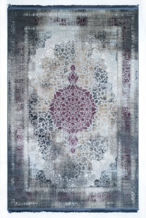 Carpets A rug with a distressed, vintage look, featuring a central floral pattern in a deep, rich color, surrounded by a