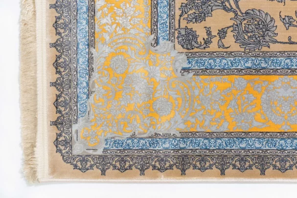 Carpets A beautiful, intricately designed carpet with a mix of yellow and blue hues, featuring a central pattern of flowers