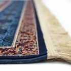 Carpets A close-up of a carpet's edge, with a focus on the intricate patterns and colors