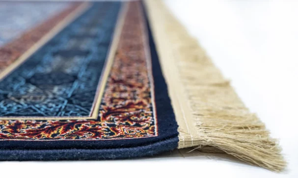 Carpets A close-up of a carpet's edge, with a focus on the intricate patterns and colors