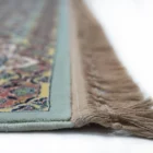Carpets A close-up of a carpet's edge, with a focus on the intricate design and the soft, fluffy texture of the carpet's edge