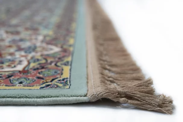 Carpets A close-up of a carpet's edge, with a focus on the intricate design and the soft, fluffy texture of the carpet's edge