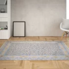 A beautiful, intricately designed carpet in a living room, adding a touch of elegance and comfort to the space, with a focus