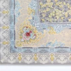 A Qaleen Carpets rug with a floral pattern and fringe on a white background