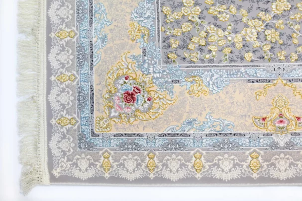 A Qaleen Carpets rug with a floral pattern and fringe on a white background