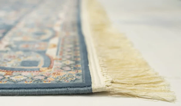 Carpets A close-up of a rug's edge with a fringe