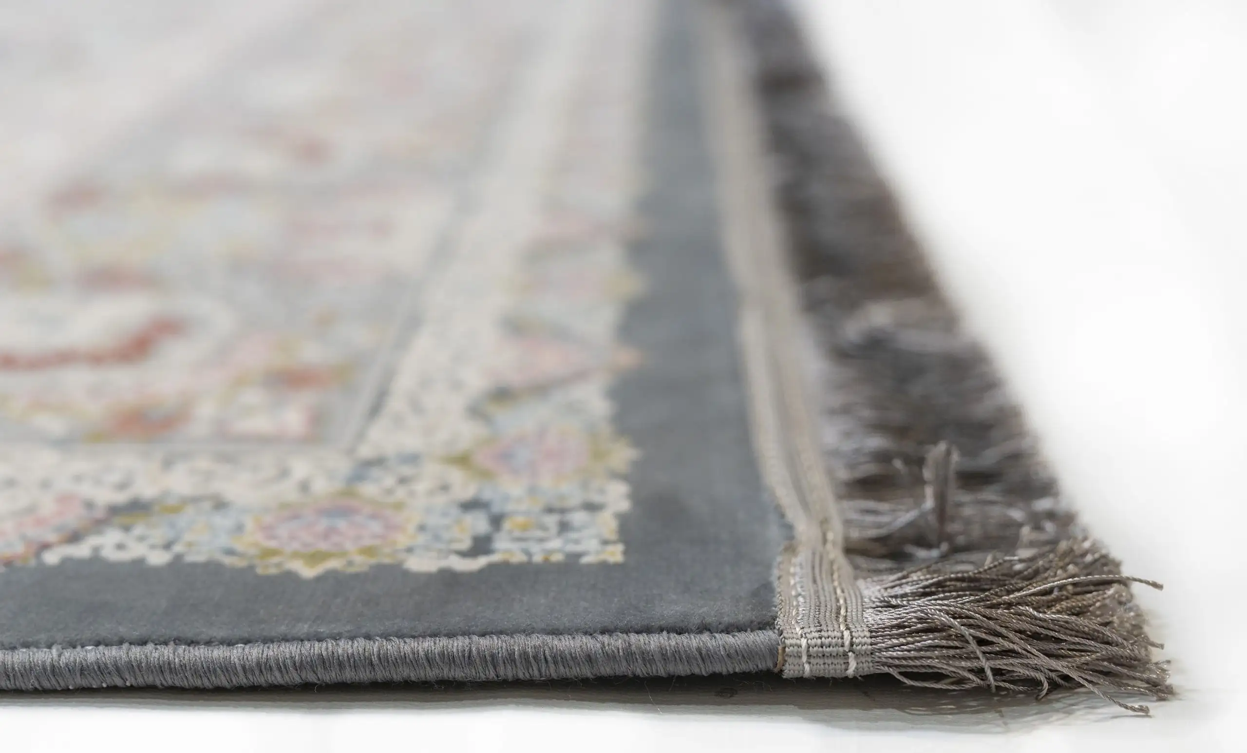 Carpets A close-up of a carpet's edge, with a focus on the intricate patterns and colors