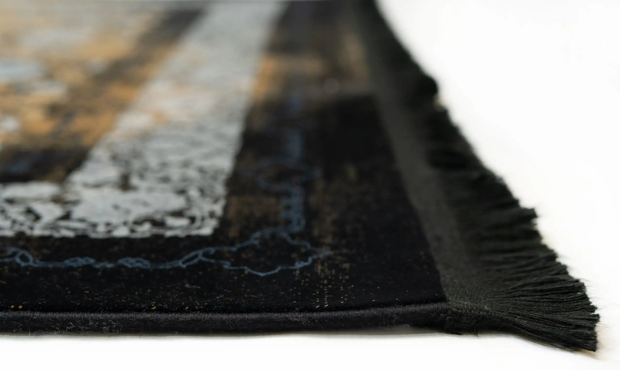 Qaleen Carpets' stunning black and gold area rug