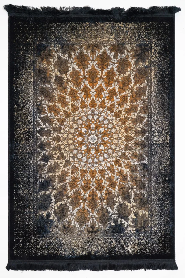 A Qaleen Carpets rug with a central gold and white floral pattern surrounded by a dark border, on a white background