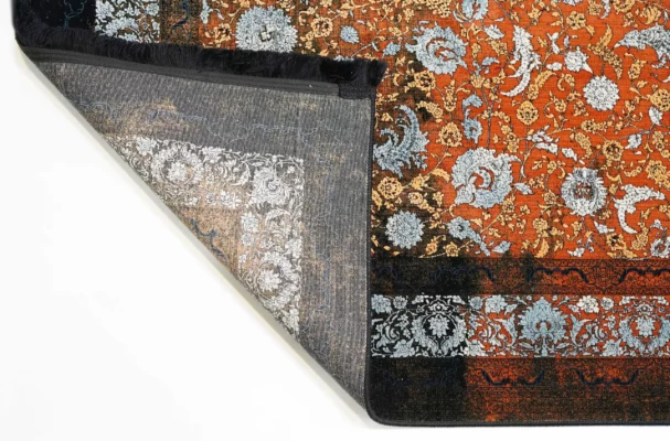 A beautifully crafted carpet with intricate patterns and a rich, vibrant color, perfect for adding a touch of elegance to