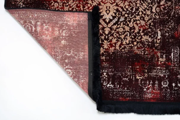 A beautifully designed carpet with a rich, intricate pattern, perfect for adding a touch of elegance to any room, with a