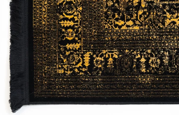 Carpets A close-up of a carpet's edge, with a black and gold pattern