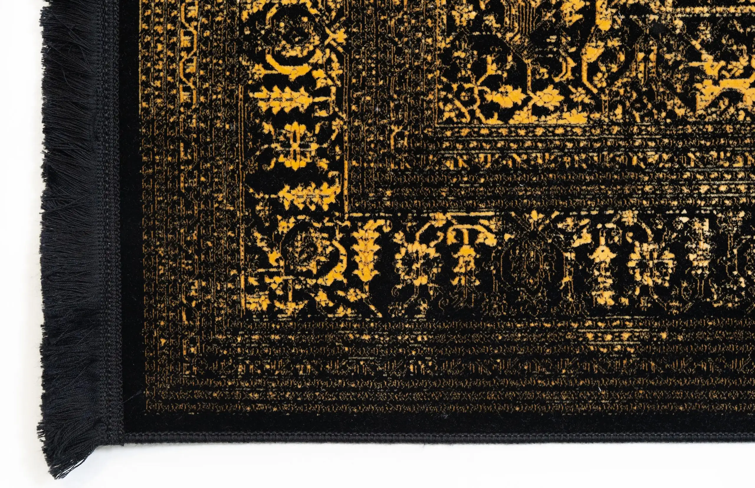 Carpets A close-up of a carpet's edge, with a black and gold pattern