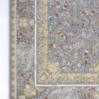 A beautiful, intricately designed carpet with a floral pattern, featuring a mix of colors and a soft, carpet-like texture,