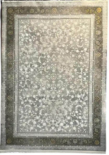 A close-up of a rug with a floral pattern, made by Qaleen Carpets