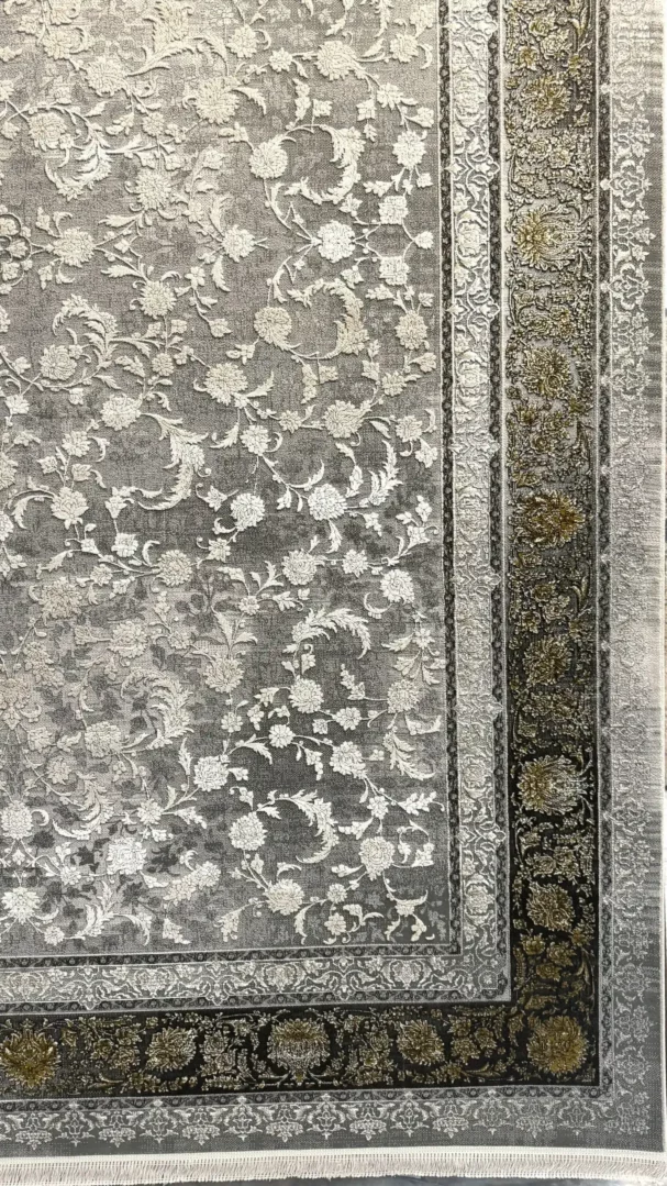 Carpets A beautiful, intricately designed carpet with a mix of dark and light colors, featuring a central pattern of flowers