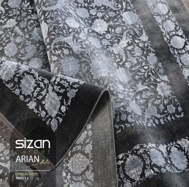 Carpets A close-up of a dark, patterned carpet with a floral design, with a rolled-up section in the foreground