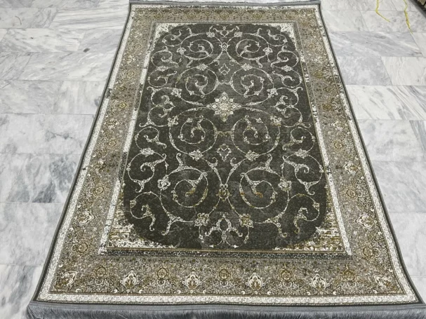 Carpets A beautiful, intricately designed carpet with a rich, dark color and a pattern of intricate, interw