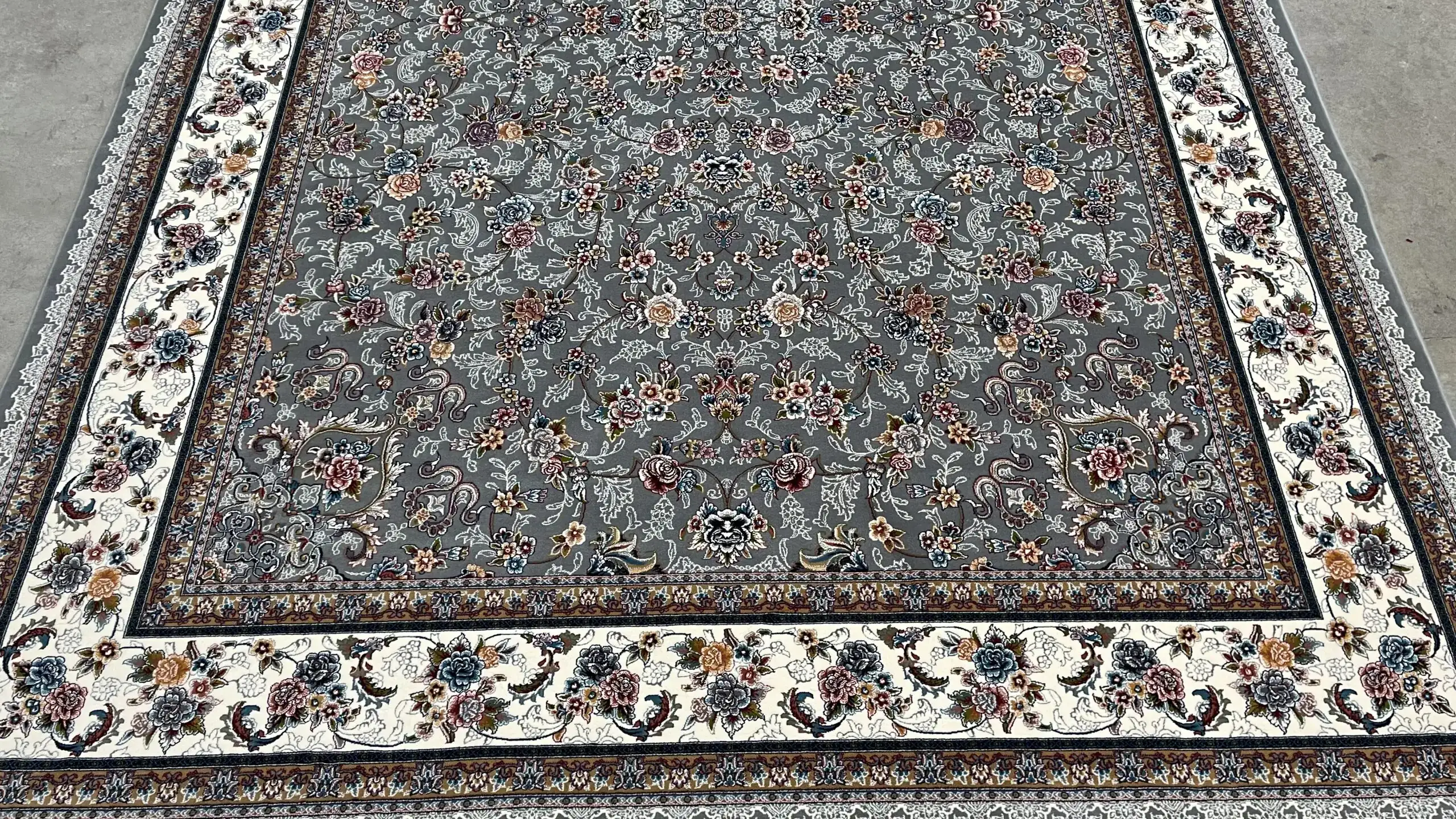 Carpets A beautiful, intricately designed carpet with a gray and white color scheme, featuring a floral pattern and a border