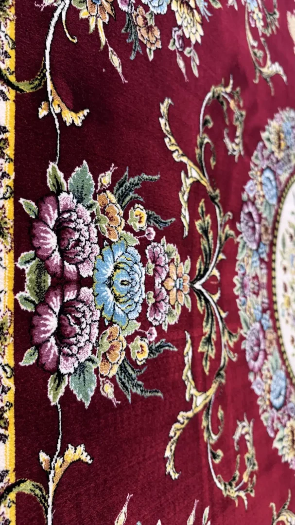Carpets A close-up of a red carpet with a floral pattern