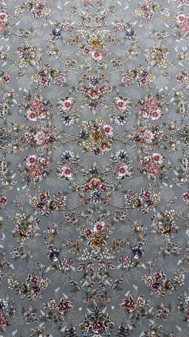 Carpets A beautiful, intricate pattern of flowers and leaves on a gray background, typical of a high-quality carpet or rug