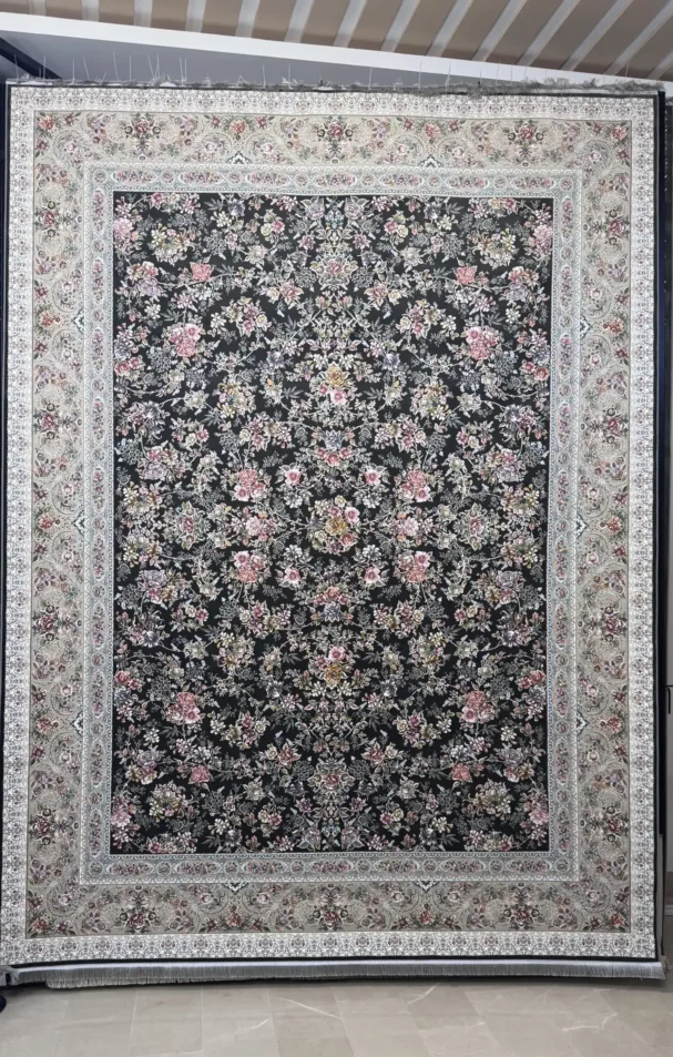 Carpets A large, dark green carpet with a floral pattern